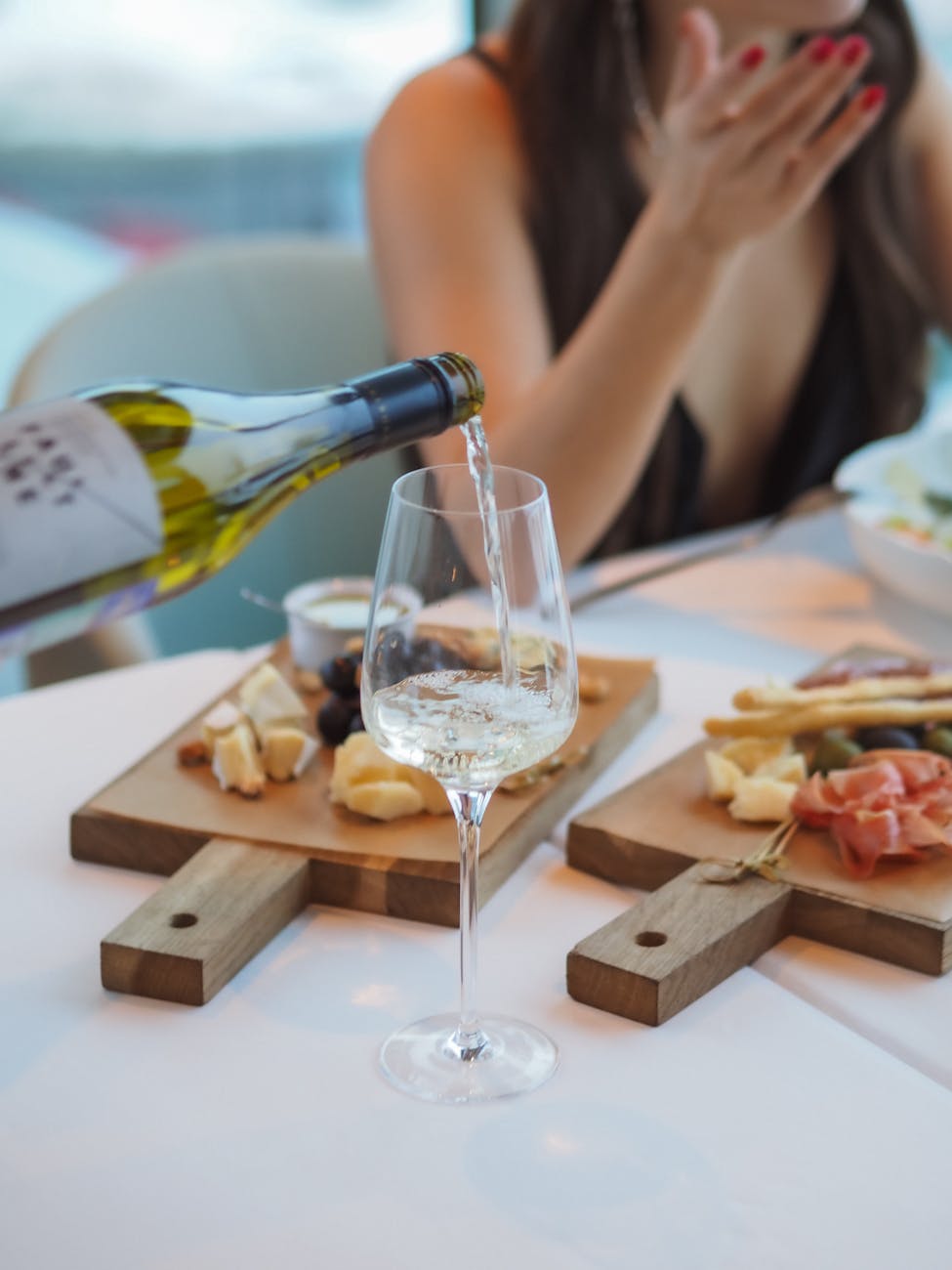 having a glass of white wine