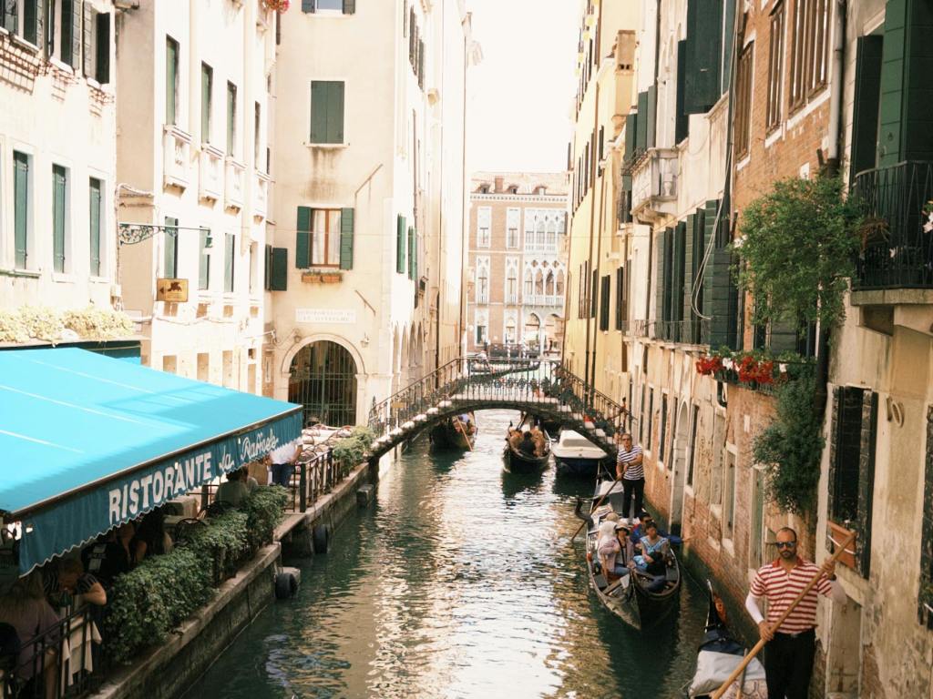 charming venetian canal with gondolas in venice
